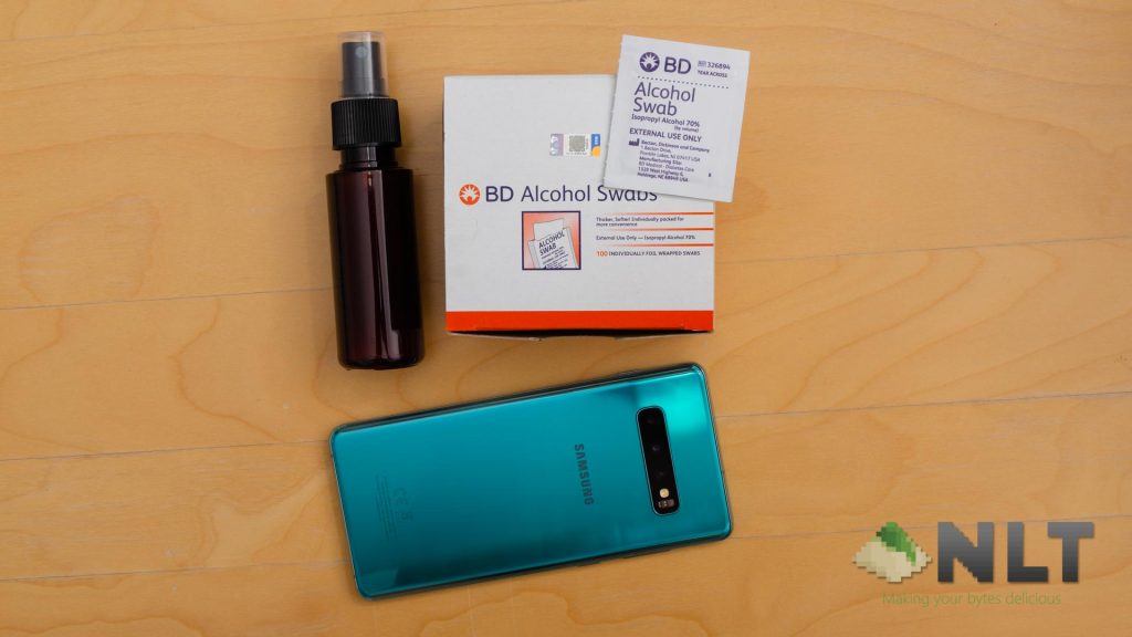 Cleaning gadgets smartphones with hand sanitizer