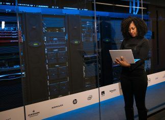 What is Enterprise Private Network (EPN) software engineer standing beside server racks