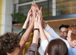 7 Ways to Gamify Your Company’s Training photo of people touching each other s hands