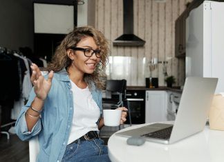 5 Tips to Improve Your Internet for Video Conferencing woman using laptop doing a video call