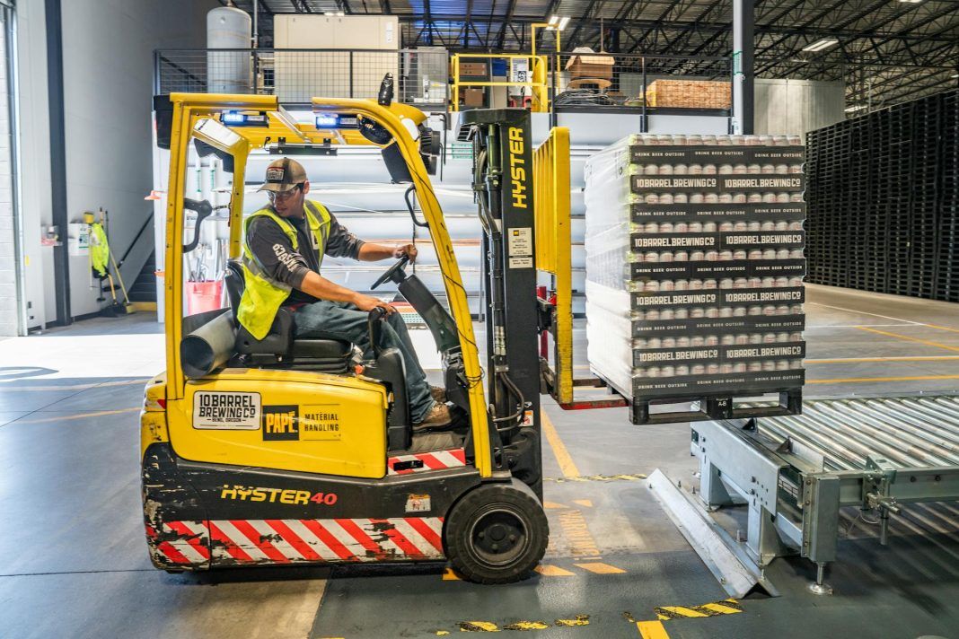 pexels-photo-1267338 person using forklift