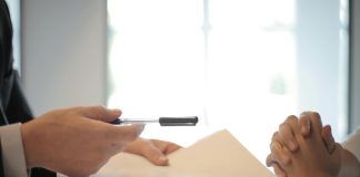 crop businessman giving contract to woman to sign