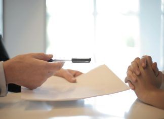 New Trends in the Microloan Market in Malaysia crop businessman giving contract to woman to sign