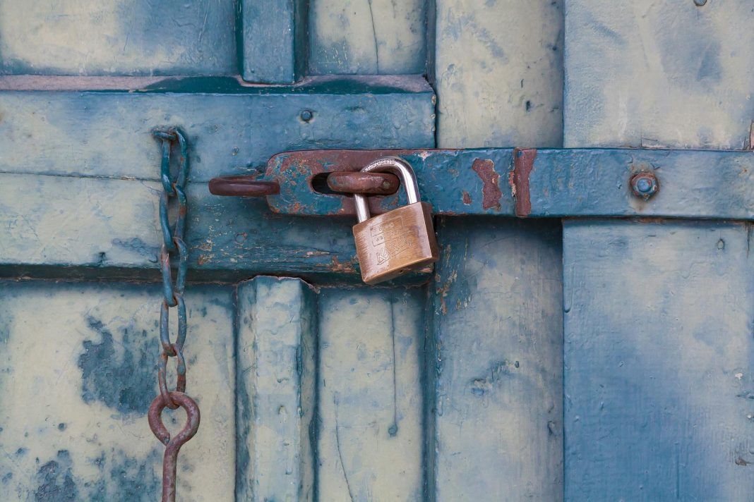 pexels-photo-164425 gold padlock locking door