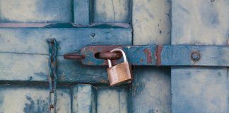 gold padlock locking door