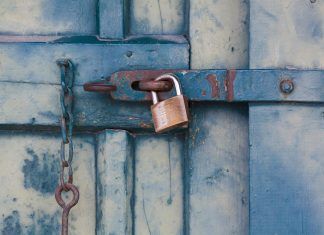 gold padlock locking door