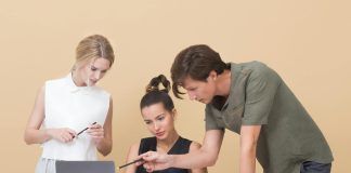 colleagues looking at laptop