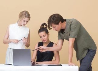 colleagues looking at laptop
