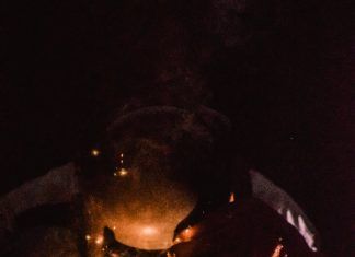 photography of a person wearing welding mask