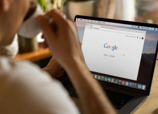 Ranking The Best SEO Agency in Malaysia person using macbook drinking coffee