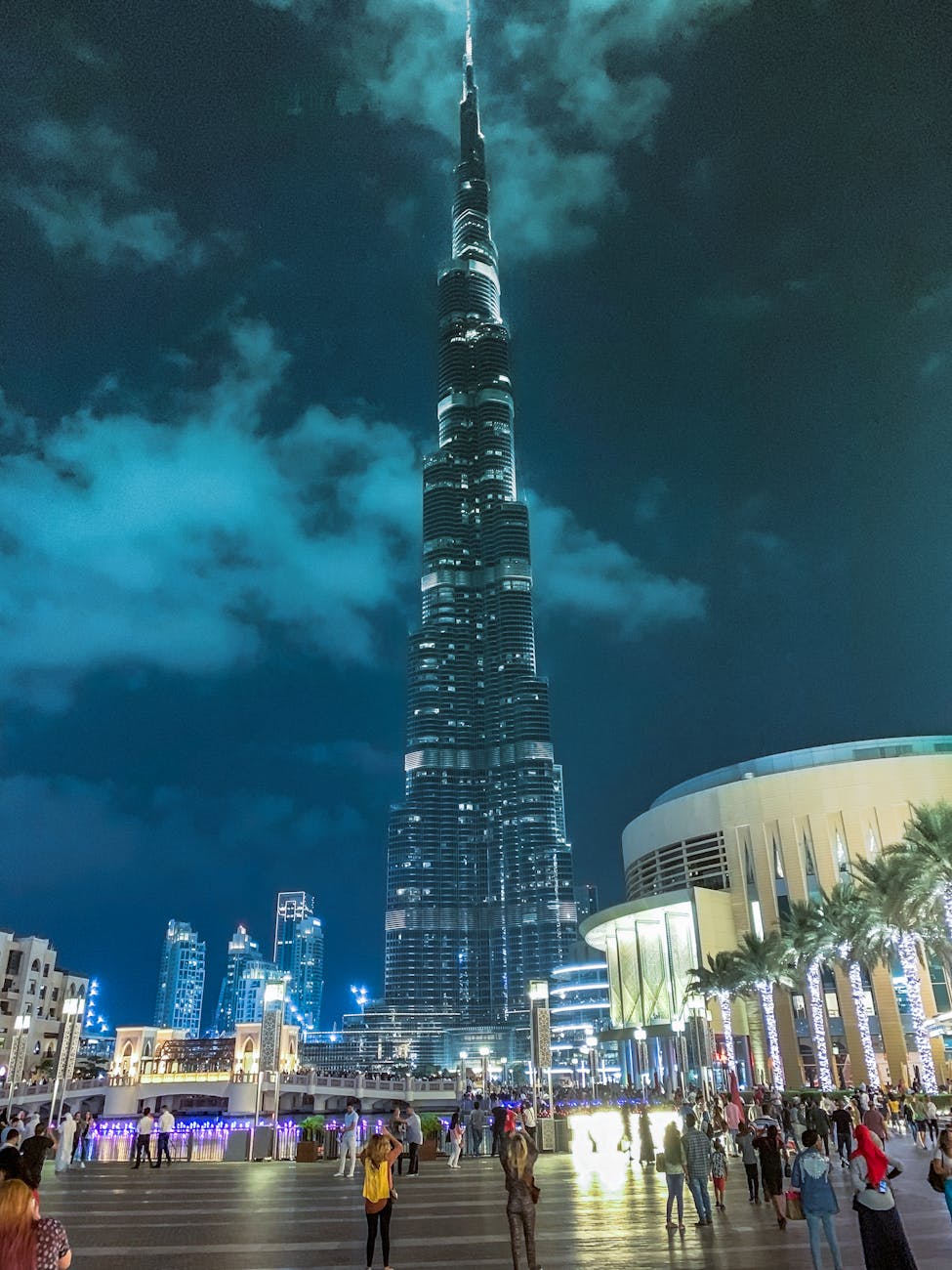 pexels-photo-1707310 people standing near high rise building during night time