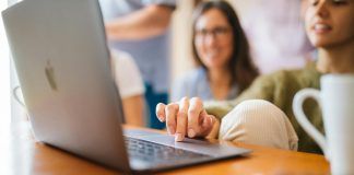 close up photo of woman using laptop