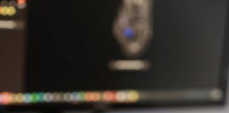 crop person working on computer and using mouse