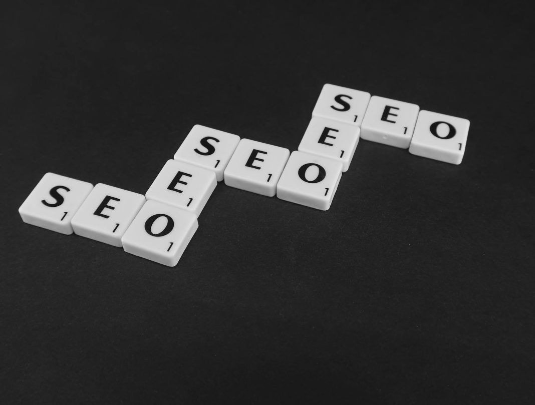 pexels-photo-7119258 white scrabble tiles on a black surface