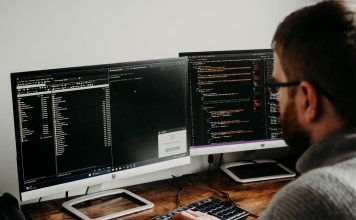 How Much Does a Web Designer Cost in Malaysia? man working on computers coding