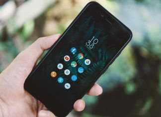 person holding black android smartphone with black case