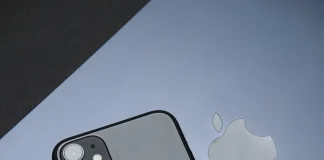 sleek apple iphone and laptop on black surface