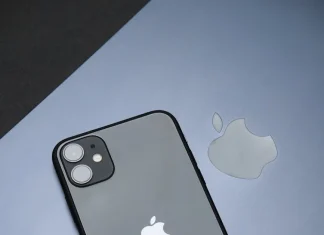 sleek apple iphone and laptop on black surface