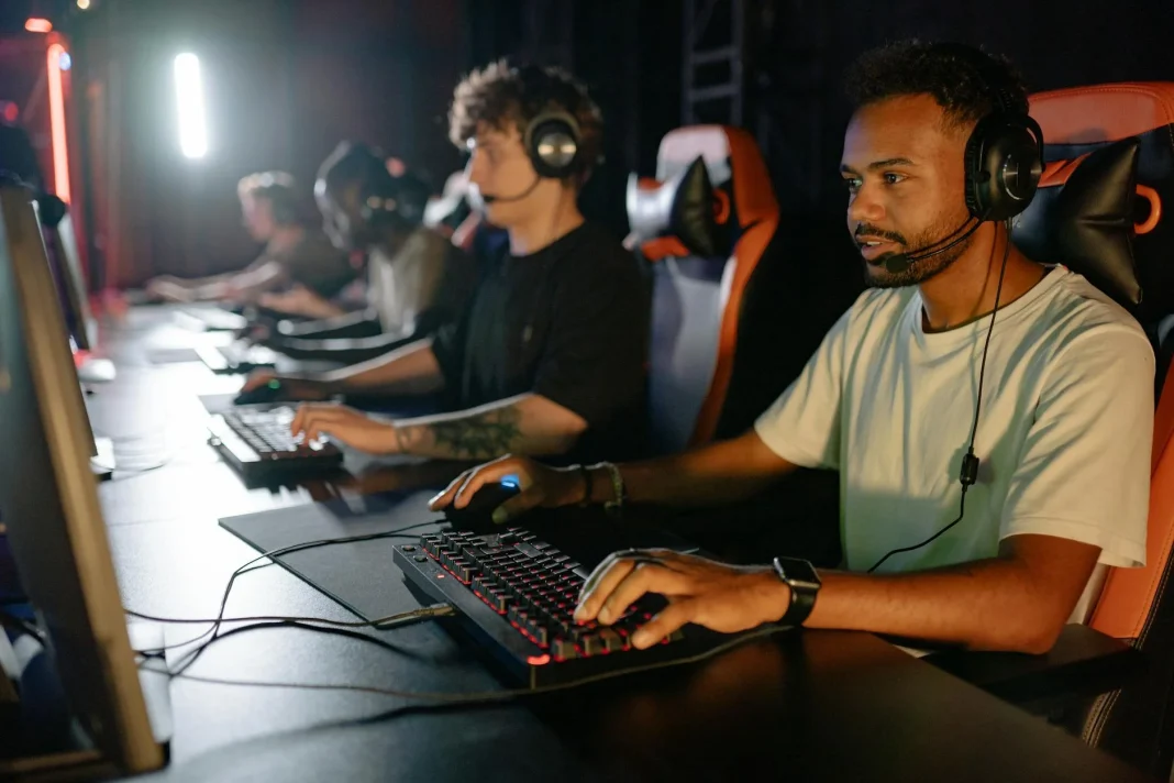 young men playing games with computers