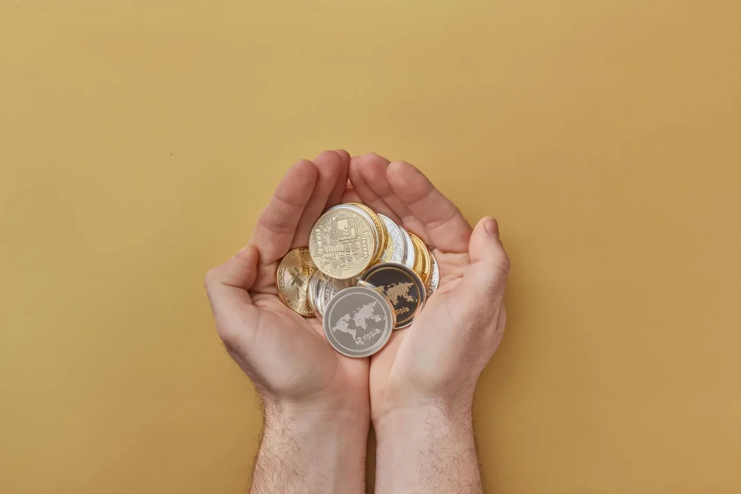 pexels-photo-7267531 person holding gold and silver round coins